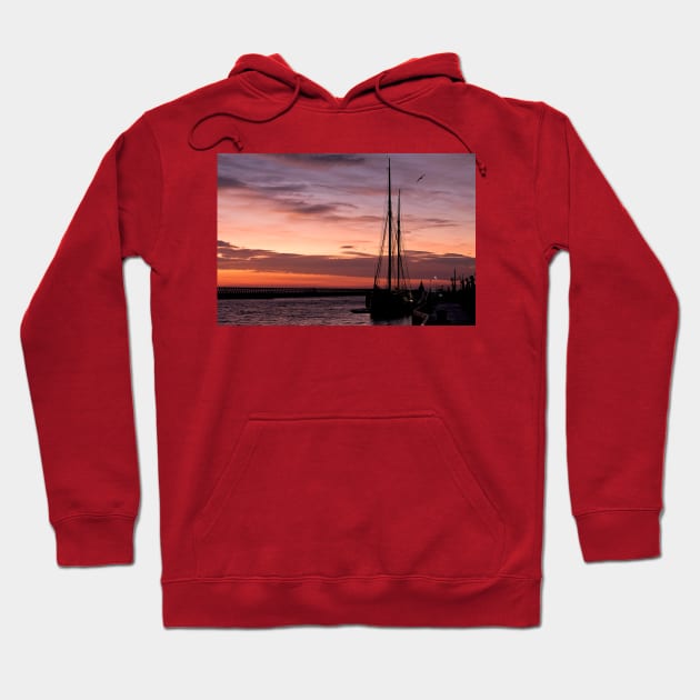 Sunrise over a Sailing Ship Hoodie by Violaman